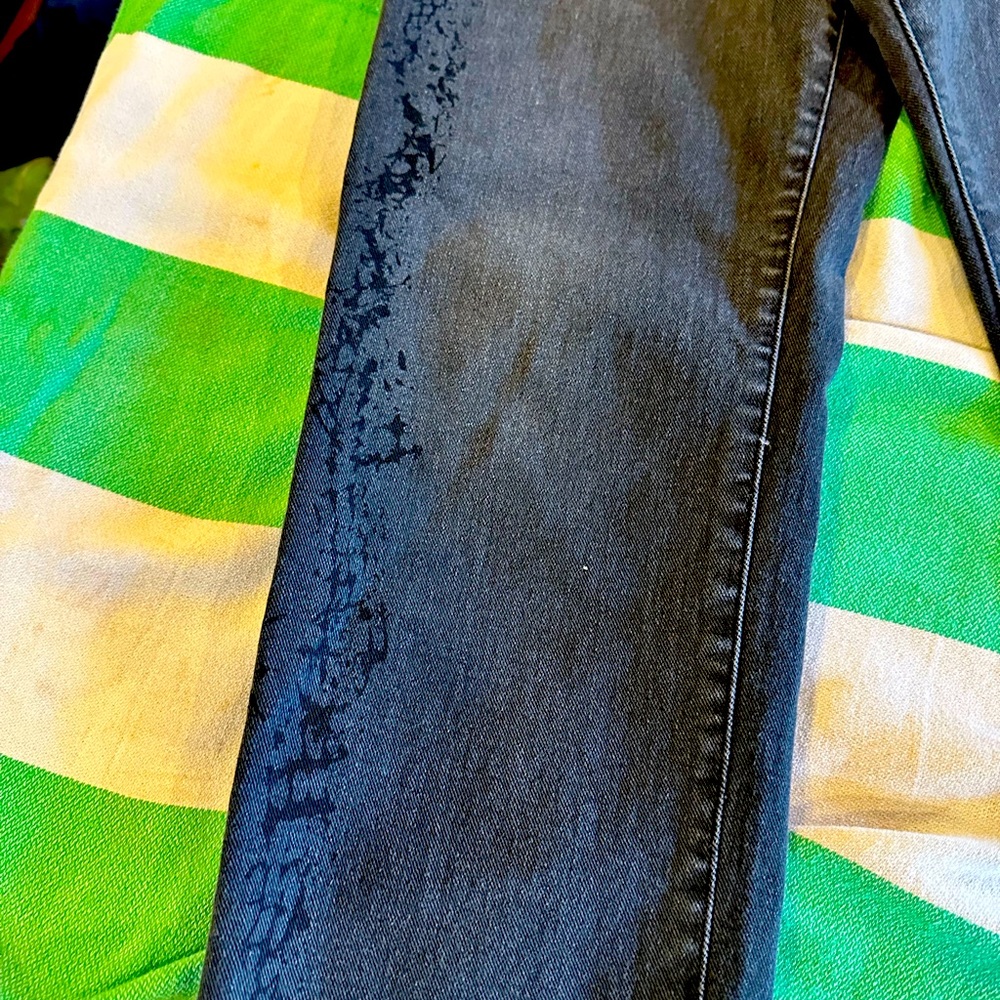 Express Jeans. Black faded with design on legs. Almost new condition.